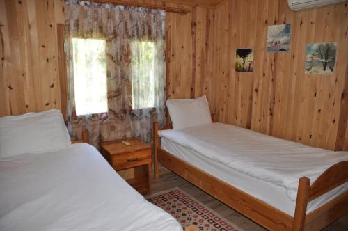 Letto o letti in una camera di Bellerofon Beach Otel