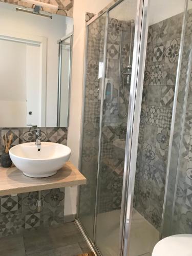 a bathroom with a sink and a shower at La Dimora delle Muse in Catania