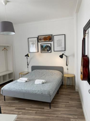 a bedroom with a bed with two towels on it at La Dimora delle Muse in Catania