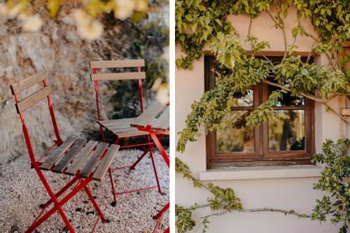 a red chair sitting outside of a window at The Lemon Lodge in Aljezur