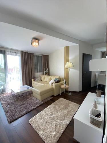 a living room with a couch and a table at Vaszary Secret Nest in Balatonfüred