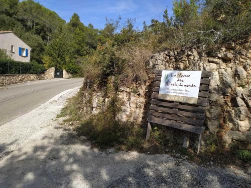 a sign sitting on the side of a road at La Maison St Gervais in Saint-Gervais