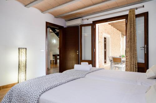 A bed or beds in a room at YourHouse Can Cuixa Villa