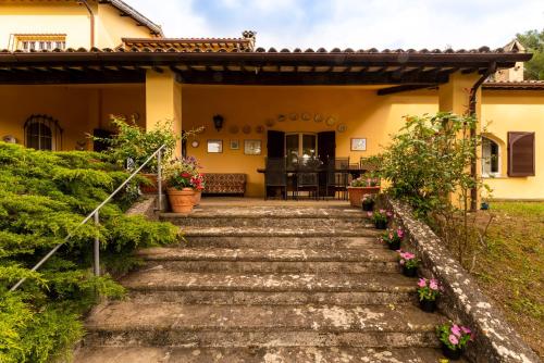 a house with stairs leading to the front yard at Villa Sara in Foligno