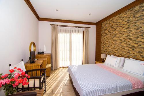 Ένα ή περισσότερα κρεβάτια σε δωμάτιο στο Mesken Inn Hotel