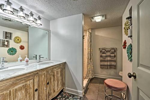 a bathroom with a sink and a mirror at Riverside Condo 2 Miles to Smoky Mtns Ntl Park! in Townsend