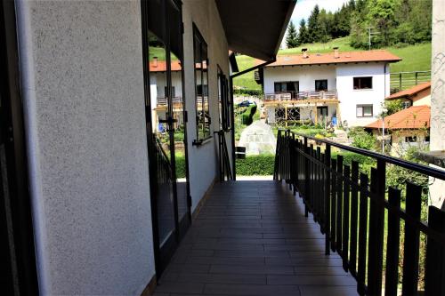 a corridor of a building with a balcony at Apartma Mika in Most na Soči