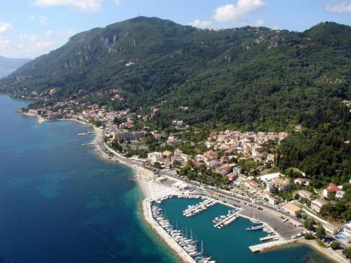 an aerial view of a harbor with boats in the water at Gardelis Gardens in Benitses