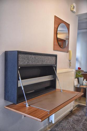 a table in a living room with a tv at Maisonette Ilios in Plisioí
