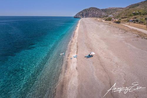 an aerial view of a beach with the ocean at Giannis Stella apartment in Mourteri