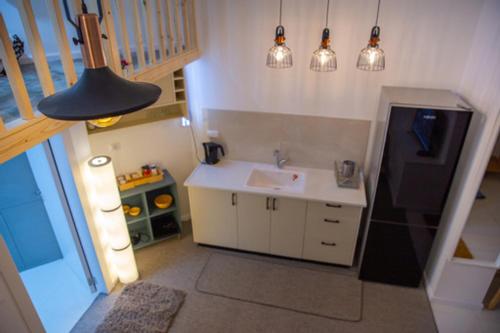 a small kitchen with a sink and a sink at Ice guest house in Majdal Shams