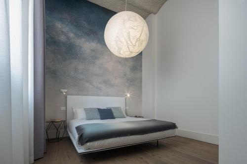 A bed or beds in a room at Fornace Loft with Dependance R&R