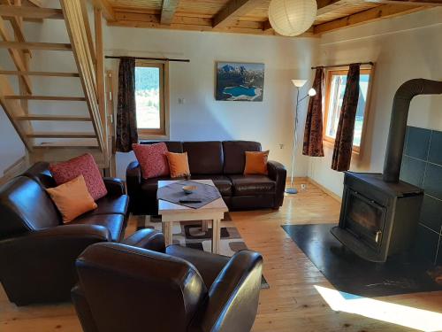 a living room with a couch and a wood stove at Zabljak Holiday in Žabljak