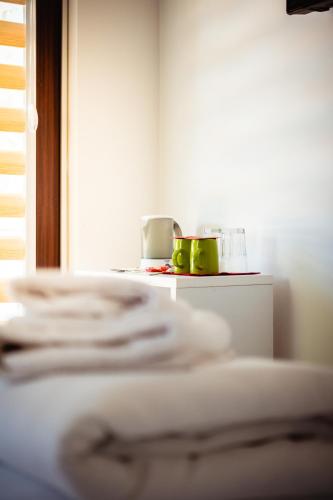 a room with a table with two cups on it at Hotel Vamos Sarajevo, b&b in Sarajevo