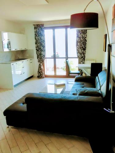 a living room with a couch and a table at Villa Relax in Stresa