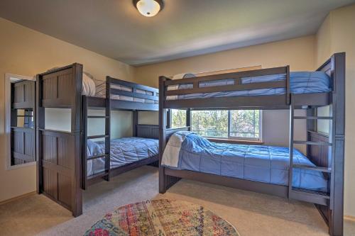 two bunk beds in a room with a window at Pet-Friendly Townhome with Hot Tub in Redmond! in Redmond