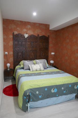 a bedroom with a large bed in a room at T2 à Sérignan Hérault in Sérignan