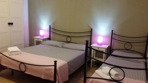 Postel nebo postele na pokoji v ubytování B&B Salvatore Lido di Noto