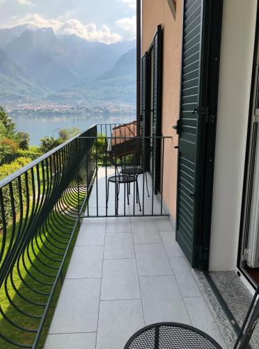 a balcony with chairs and a view of the water at B&B L'erica in Oliveto Lario