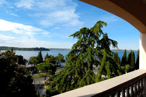 a view of the water from a balcony at Hotel Marko in Portorož