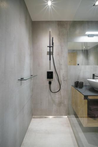 a bathroom with a shower and a sink at Atelier Garni Astei in Grossarl