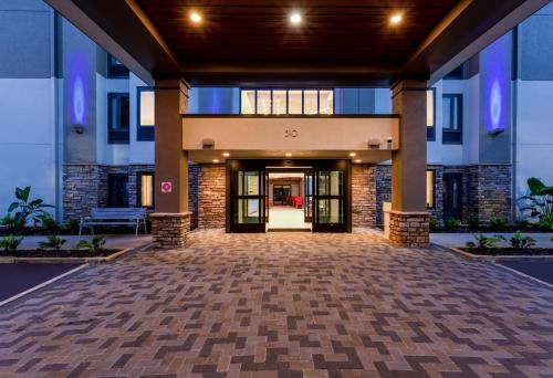 an empty lobby of a building with a hallway at Holiday Inn Express Tampa-Brandon by IHG in Brandon