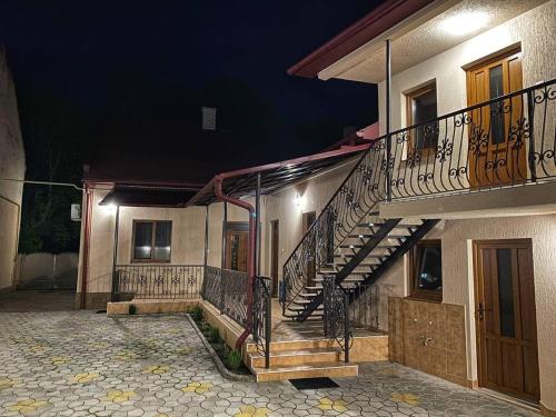 a building with a staircase on the side of it at Villa Magda in Berehove