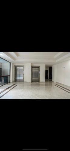 a large empty room with a dance floor at City Central Apartment in Yerevan