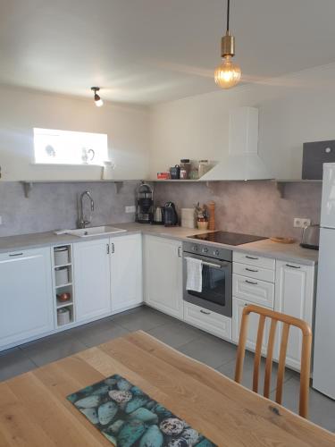 A kitchen or kitchenette at Thorshamar sea side villa