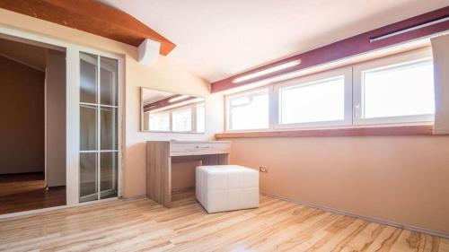 an empty room with windows and a desk in it at Villa Duda - A Unique Memory in Vodnjan