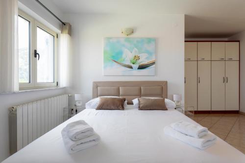 Ένα ή περισσότερα κρεβάτια σε δωμάτιο στο Apartments Jakic 1