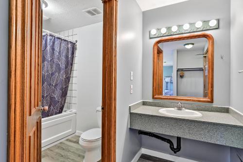 a bathroom with a shower, sink, and mirror at Samesun Banff in Banff