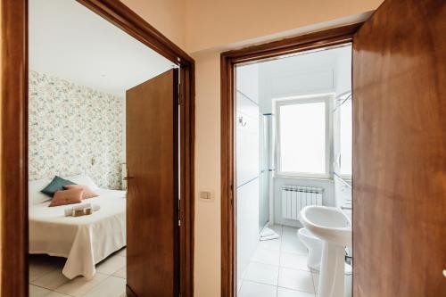 a room with a bed and a bathroom at In Centro Residenza - Suites & Apartments in Vasto