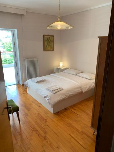 Ένα ή περισσότερα κρεβάτια σε δωμάτιο στο Apartment Nikos