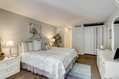 a bedroom with a bed and a television in it at Beckenham in Hilton Head Island
