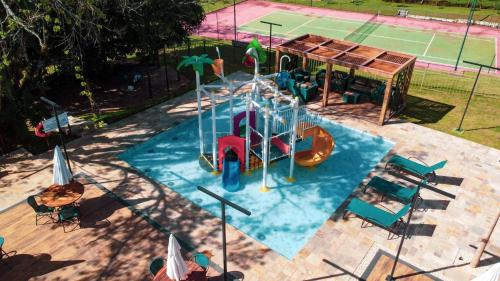 an overhead view of a pool with a playground at Hotel Pousada do Bosque in Ponta Porã