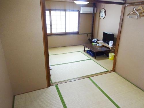 Katil atau katil-katil dalam bilik di Imazato Ryokan