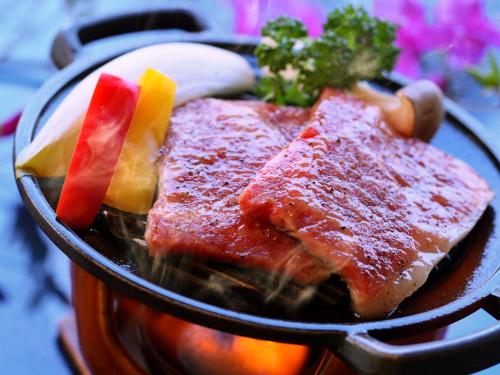 a bowl of food with meat and vegetables on a table at Jizaiso in Nasu