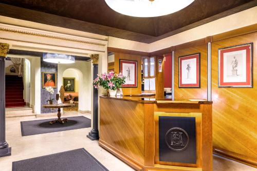a living room with a fireplace in a house at Hotel S. Anna in Rome