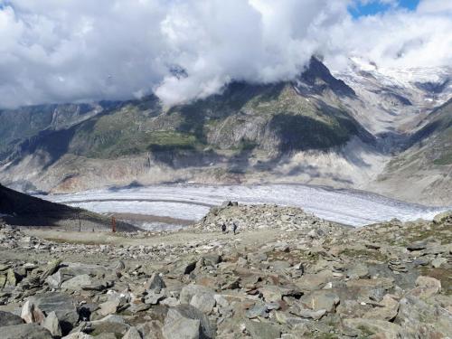 a group of people standing on top of a mountain at Hotel Derby in Fiesch