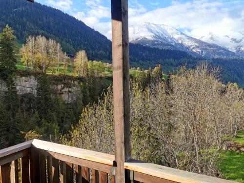 a balcony with a view of a snow covered mountain at Hotel Derby in Fiesch