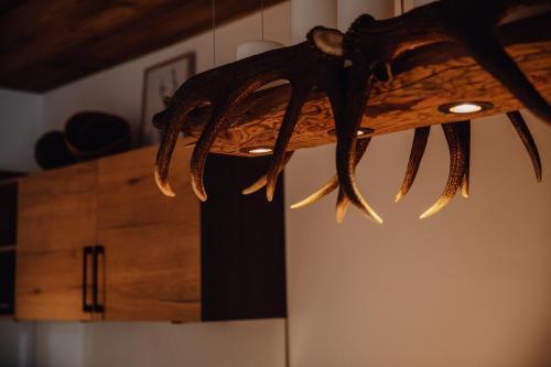 a chandelier hanging from the ceiling in a room at Zillertal Juwel in Fügen