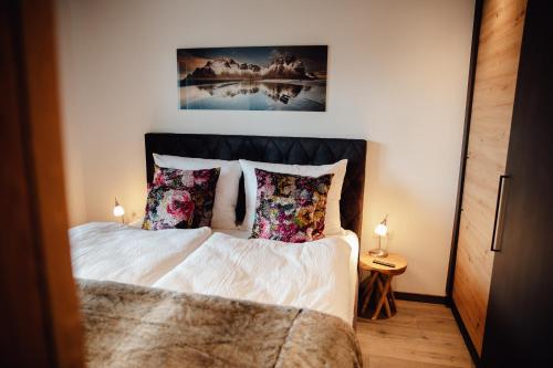 Tempat tidur dalam kamar di Zillertal Juwel