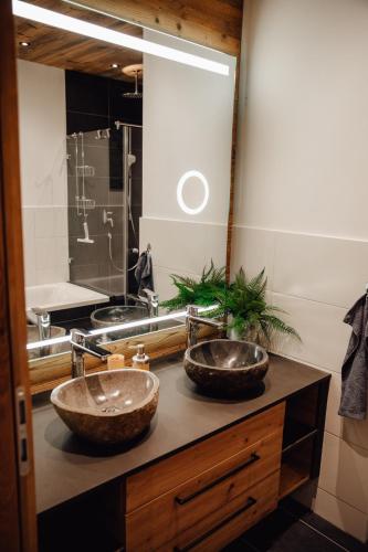 two sinks on top of a counter in a bathroom at Zillertal Juwel in Fügen