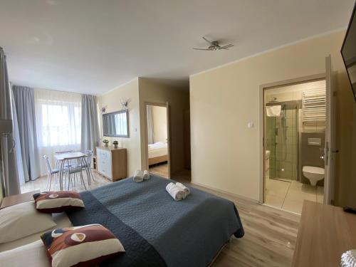 Postel nebo postele na pokoji v ubytování Lazur Apartamenty