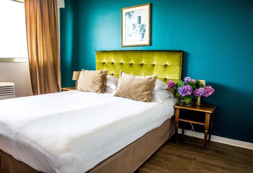 Postel nebo postele na pokoji v ubytování Hôtel Albion
