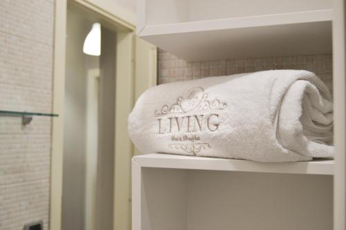 a towel sitting on top of a shelf in a bathroom at MR Living Bed & Breakfast in Boiano