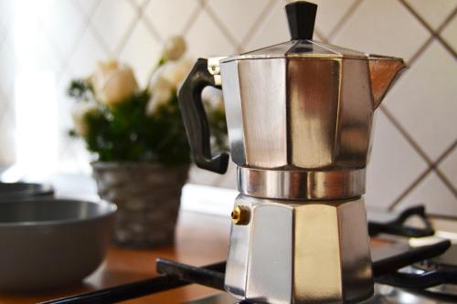 a coffee maker sitting on top of a stove at MR Living Bed & Breakfast in Boiano