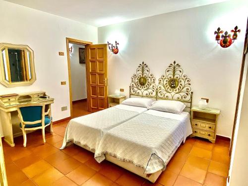 Кровать или кровати в номере Hotel Grazia Deledda