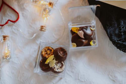 two plastic containers of donuts sitting on a table at B&B Casa Santa Lucia in Manerba del Garda
